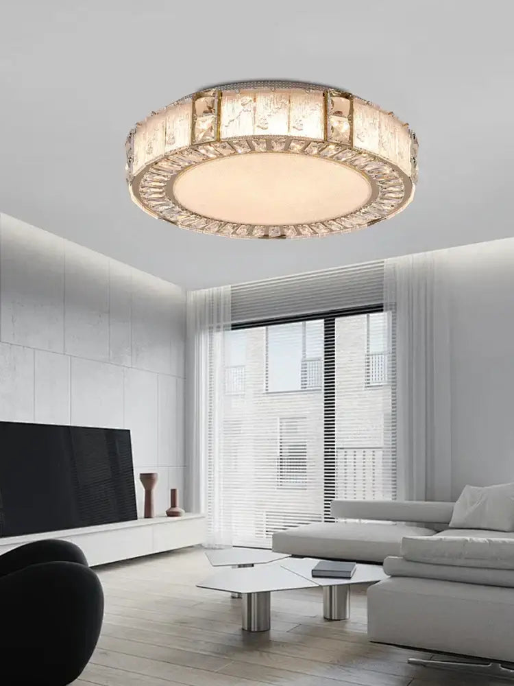 Luxury gold crystal glass chandelier with a circular frame and faceted panels for glass luxury ceiling decorbites