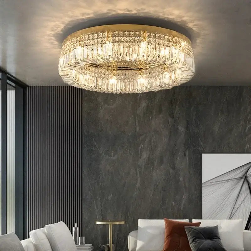 Luxury gold crystal glass round ceiling light with a circular gold-toned frame and hanging faceted glass prisms decorbites crystal glass