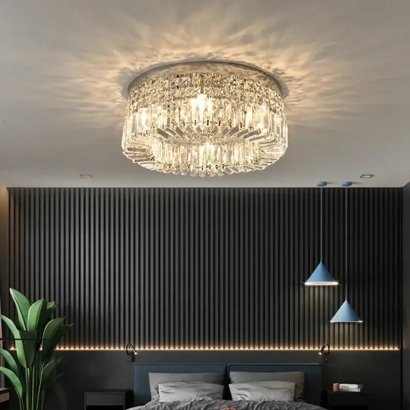 Luxury gold crystal glass round ceiling light with metallic frame and cascading clear glass prisms by decorbites