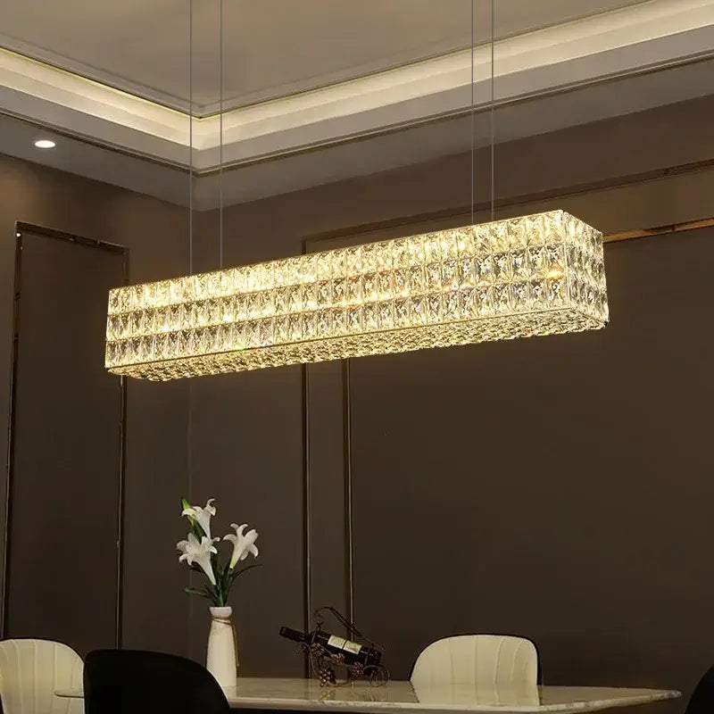 Luxury gold crystal led pendant light featuring a rectangular modern design with faceted crystals for dining room decorbites crystal led
