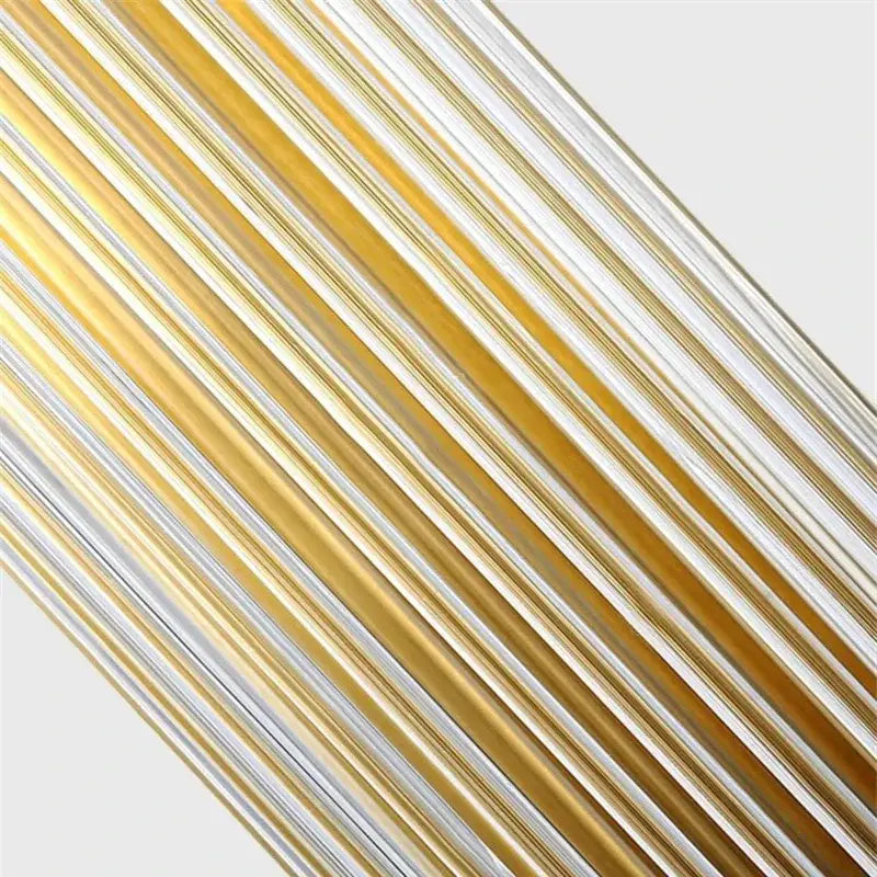 Luxury gold crystal led wall sconce with diagonal gold and silver metallic strips and polished glass prism finish