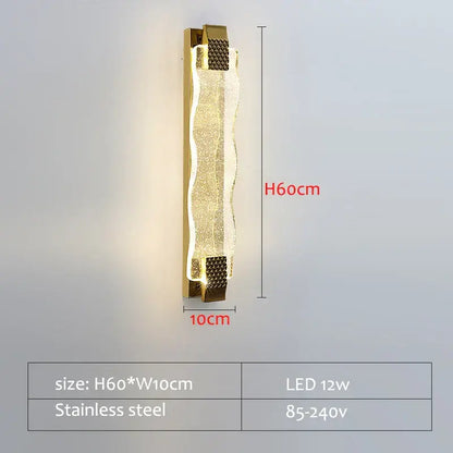 Gold-toned decorbites crystal led wall sconce with textured wavy glass panel and stainless steel frame for living room decor