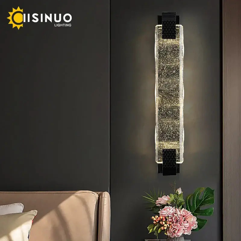 Modern rectangular wall sconce with clear crystal led body and black metal accents for luxury living room decorbites crystal led
