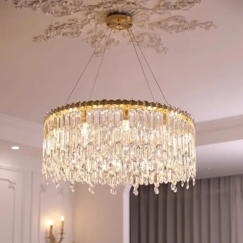 Luxury gold crystal pendant chandelier featuring cascading clear crystal prisms for elegant living room decorbites crystal pendant