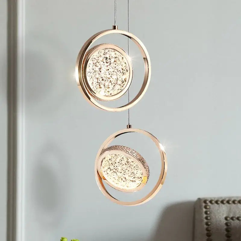 Modern rose gold pendant light with sparkling decorbites crystal ring accents for luxury bedroom lighting