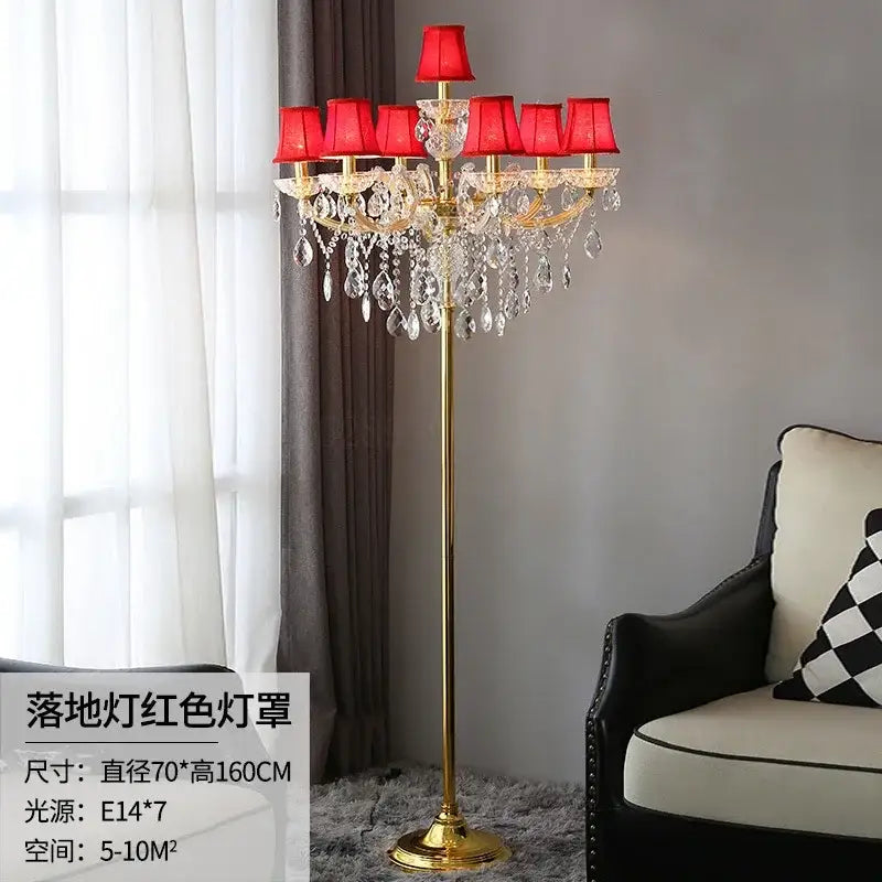 Elegant gold crystal table light with six red fabric shades and dangling crystal droplets for luxury bedroom décor