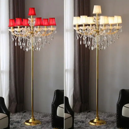 Luxury gold crystal table light with chandelier-style arms, dangling teardrop crystals, and red fabric shades