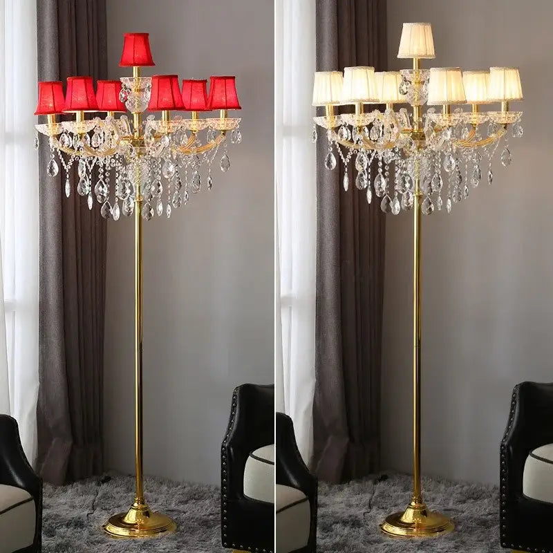Luxury gold crystal table light with chandelier-style arms, dangling teardrop crystals, and red fabric shades