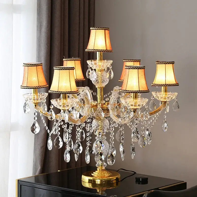 Luxury gold crystal table light chandelier lamp with warm-lit shades and faceted glass droplets for bedroom use