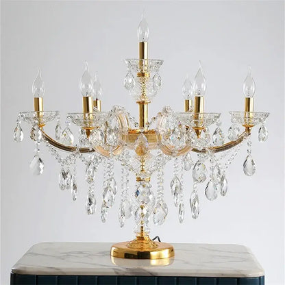 Luxury gold crystal table light with multiple arms and clear faceted crystals for elegant bedroom lighting