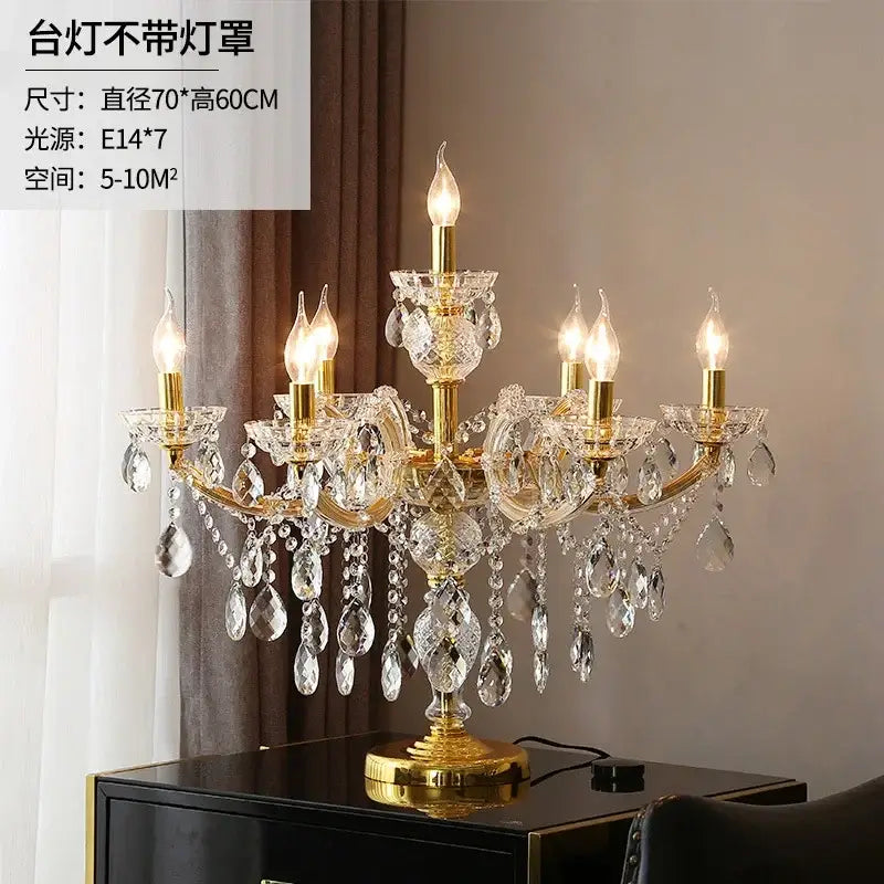 Luxury gold crystal table light featuring a chandelier-style design with candle-like bulbs and dangling crystals