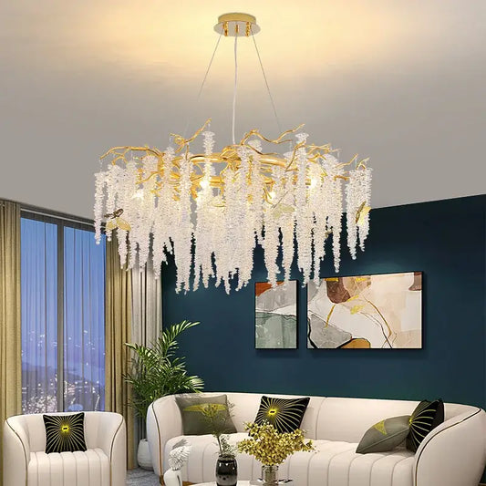 Elegant gold crystal tassel chandelier with cascading white crystal strands resembling a tree branch for living room decorbites crystal tassel lighting
