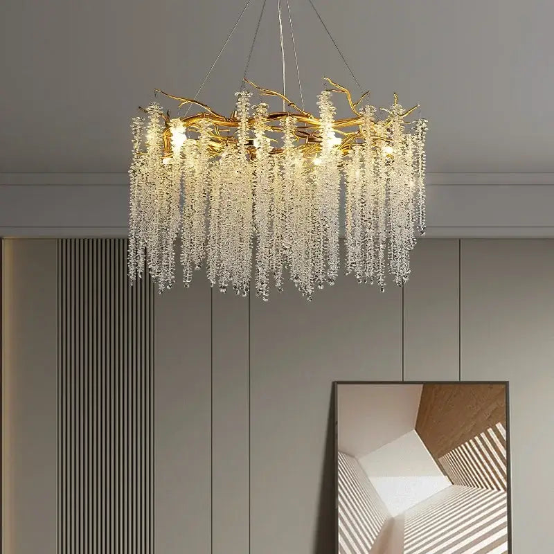 Luxury gold crystal tassel chandelier featuring a golden branch design with cascading clear crystal droplets decorbites crystal tassel