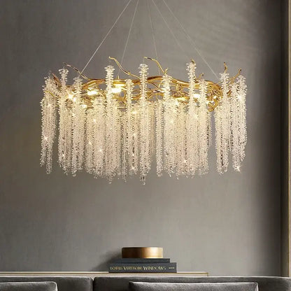 Luxury gold crystal tassel chandelier featuring a golden branch design with cascading clear crystal droplets decorbites crystal tassel