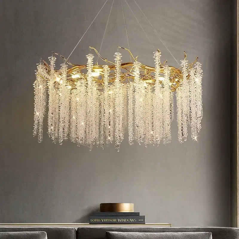 Luxury gold crystal tassel chandelier featuring a golden branch design with cascading clear crystal droplets decorbites crystal tassel