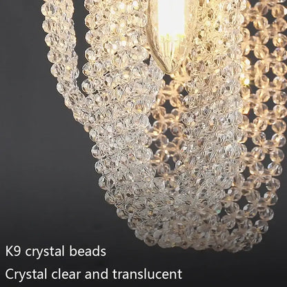 Luxury gold pendant lamp featuring a cascading decorbites crystal tassel made of clear faceted k9 crystal beads for bedside lighting