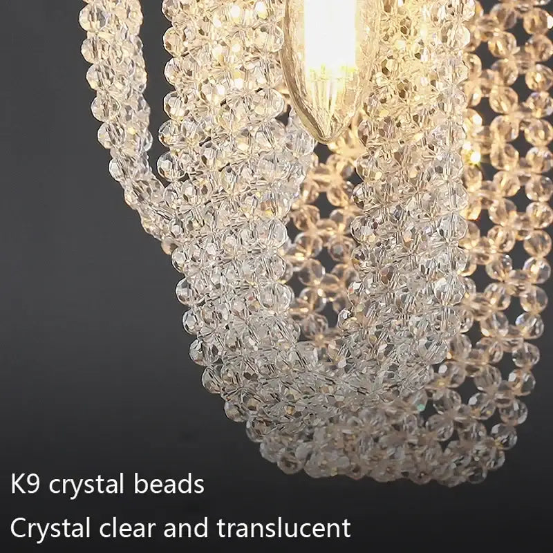 Luxury gold pendant lamp featuring a cascading decorbites crystal tassel made of clear faceted k9 crystal beads for bedside lighting
