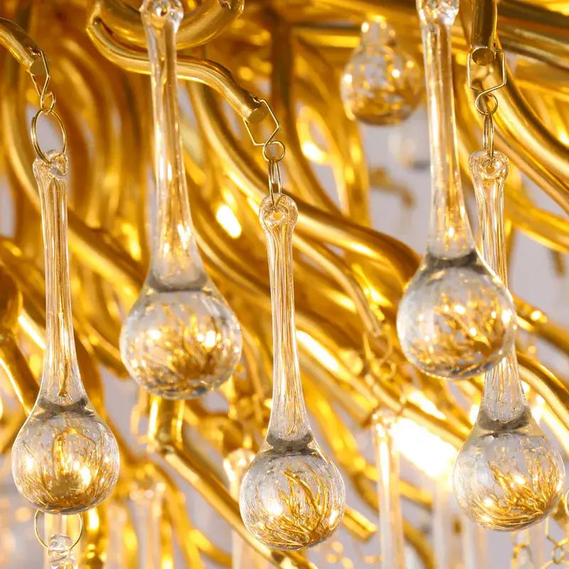 Luxury gold crystal tree branch chandelier with clear glass teardrop pendants and intricate gold-toned metalwork for living room decorbites crystal tree