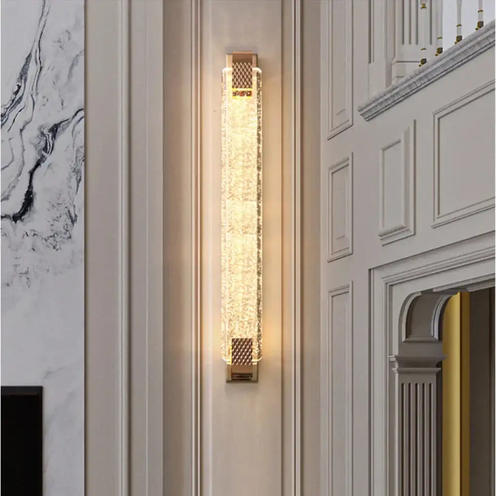 Luxury gold crystal wall lamp with illuminated textured crystal panel and decorative mesh accents for living room lighting