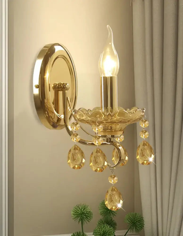 Luxury gold crystal wall sconce with amber crystal droplets and candle-style bulb for decorbites crystal chandeliers decor