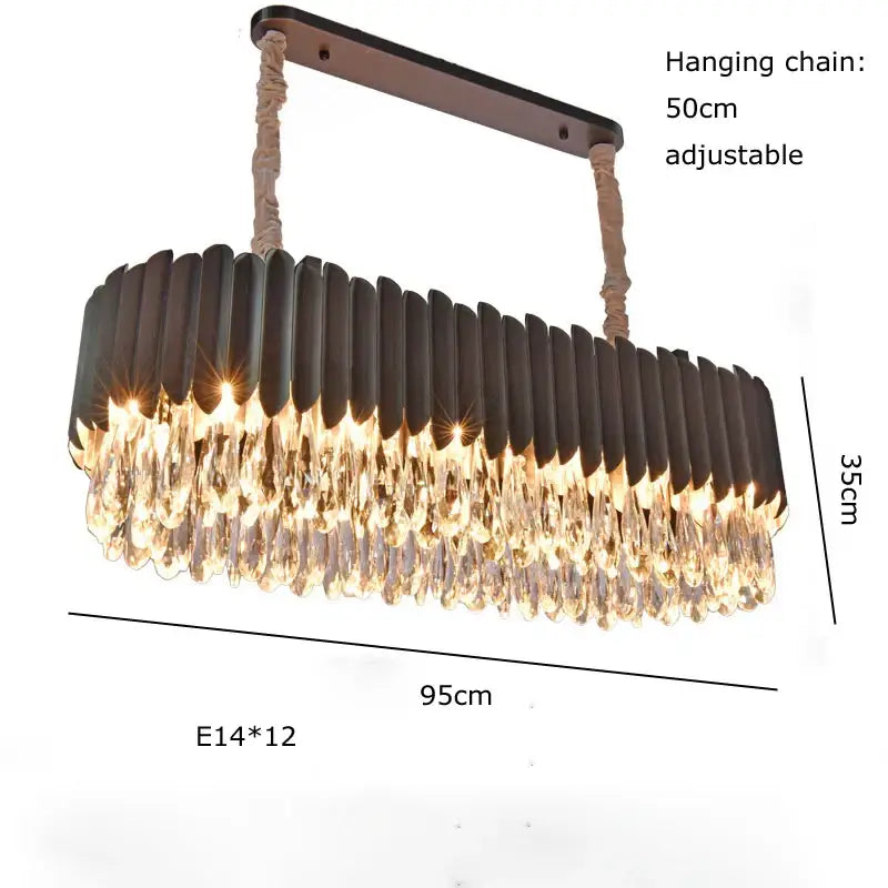 A modern luxury gold crystal water droplet pendant light with dark bronze frame and 12 e14 bulbs for dining room decorbites crystal water