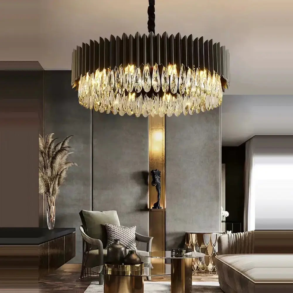 A modern pendant light with a sleek black metal frame and decorbites crystal water droplet tiers for dining room decor