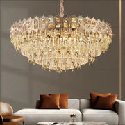 Luxury gold decorbites crystal chandelier with cascading faceted glass tiers and intricate metalwork for living room