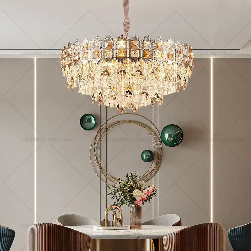 Luxury gold decorbites crystal chandelier with multi-tiered gold metal, clear crystals, and amber panels for living room