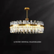 Luxury gold decorbites crystal chandeliers featuring cascading clear crystal prisms for elegant dining rooms