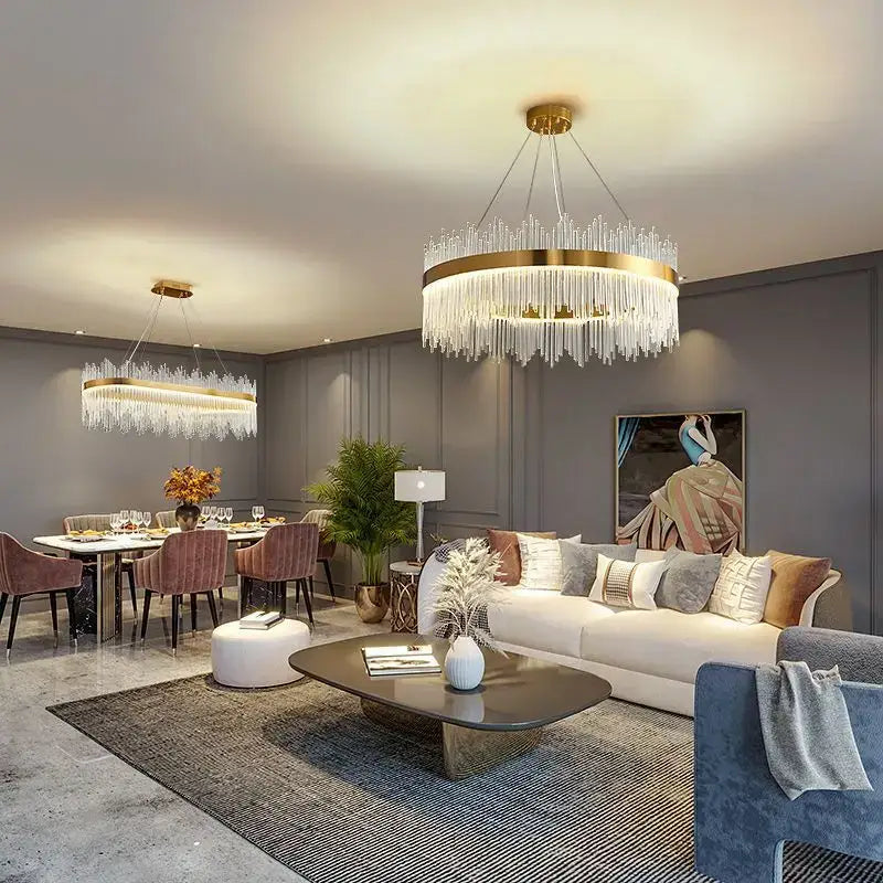 A luxury gold decorbites crystal led chandelier with a circular frame and cascading clear crystal strands for dining rooms
