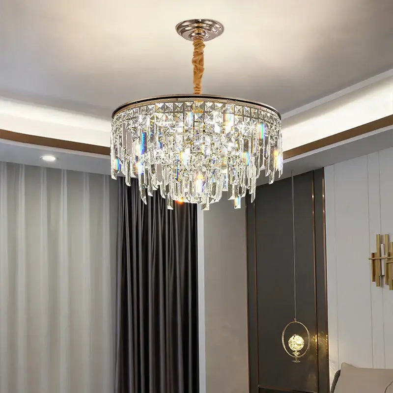 Luxury gold decorbites crystal led chandelier with polished brass finish and cascading clear faceted crystals for living room