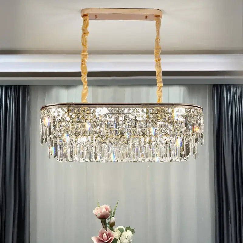 A luxury decorbites crystal led chandelier with a rose gold frame and twisted golden chains for living room