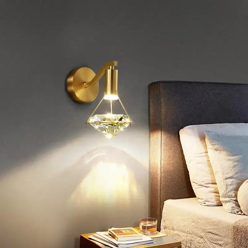Luxury gold diamond crystal wall lamp featuring a gold-toned wall lamp with a faceted crystal glass shade for living room