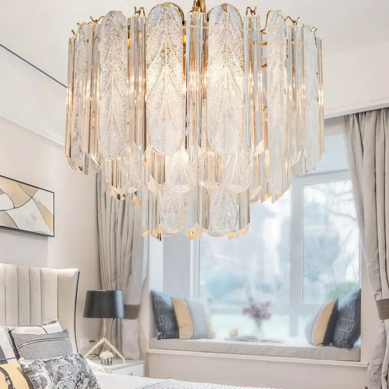 Luxury gold leaf crystal bedroom pendant lamp with cascading textured glass panels reflecting light decorbites crystal bedroom