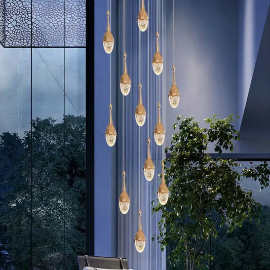 Luxury gold led staircase chandelier with crystal accents hangs elegantly as decorbites gold led living room pendant light