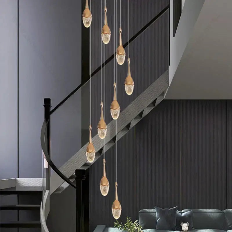 Luxury gold led staircase chandelier with gold teardrop-shaped crystal pendant lights for elegant living room decorbites gold led