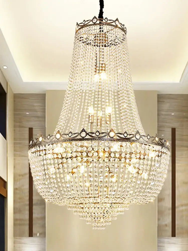 Luxury gold multi tier crystal led chandelier with ornate metallic frame and cascading clear crystals by decorbites crystal led