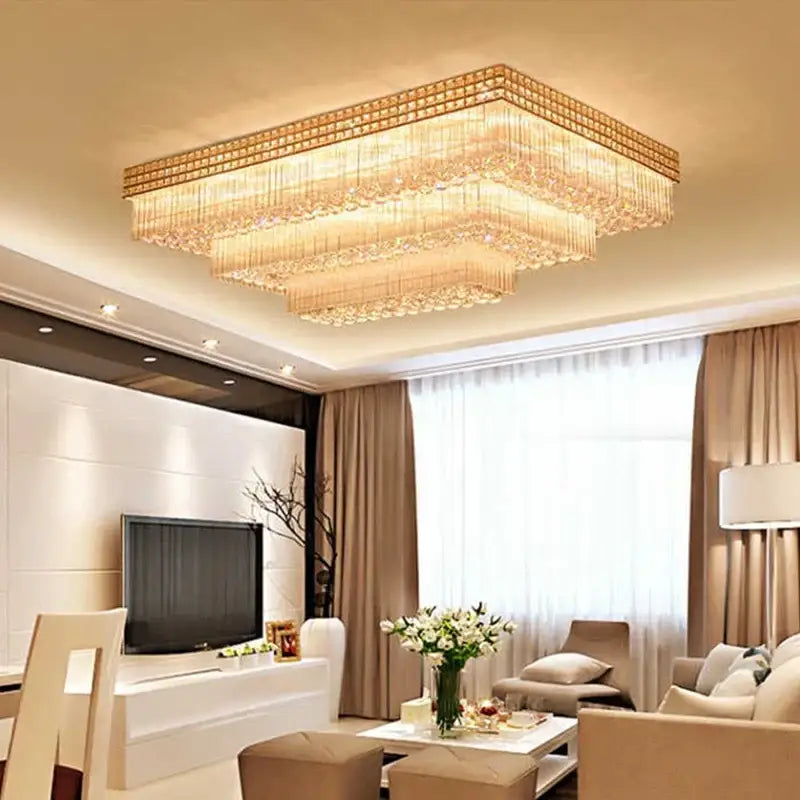 Luxury gold multi-tiered crystal led chandelier with tiered cascading clear and golden-toned crystals for living room