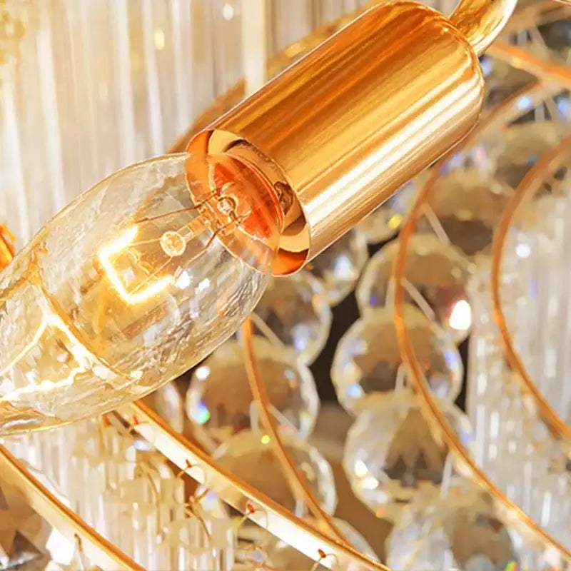 Luxury gold multi-tiered crystal led chandelier with golden filament bulb in clear glass and polished brass socket for living room