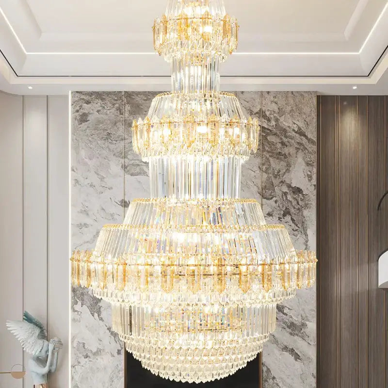 Luxury gold multi-tiered DecorBites crystal chandelier with cascading clear glass prisms for living room decor