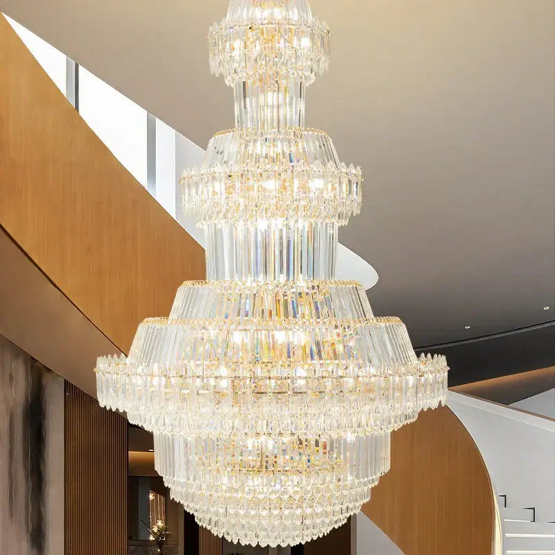 Luxury gold multi-tiered decorbites crystal chandelier with cascading clear glass prisms for living room decor