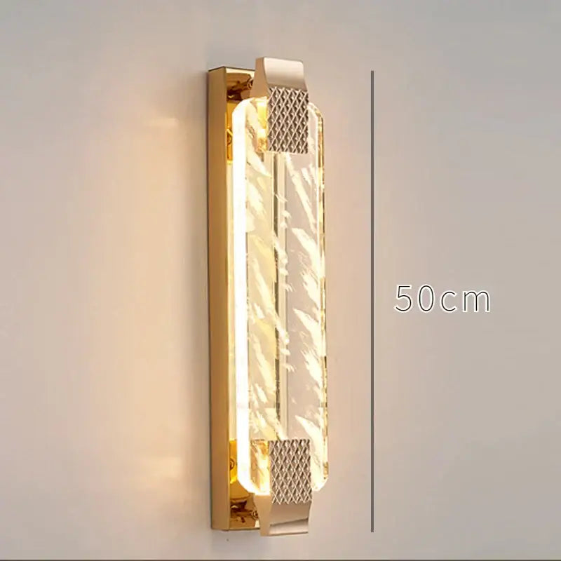 Luxury gold rectangular crystal wall lamp with clear textured panel and mesh accents for bedroom decor featuring decorbites crystal wall design