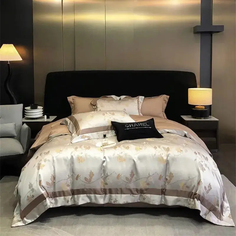 Elegant ivory satin bedding set with gold-toned floral embroidery taupe border and black Chanel brocade satin jacquard pillow
