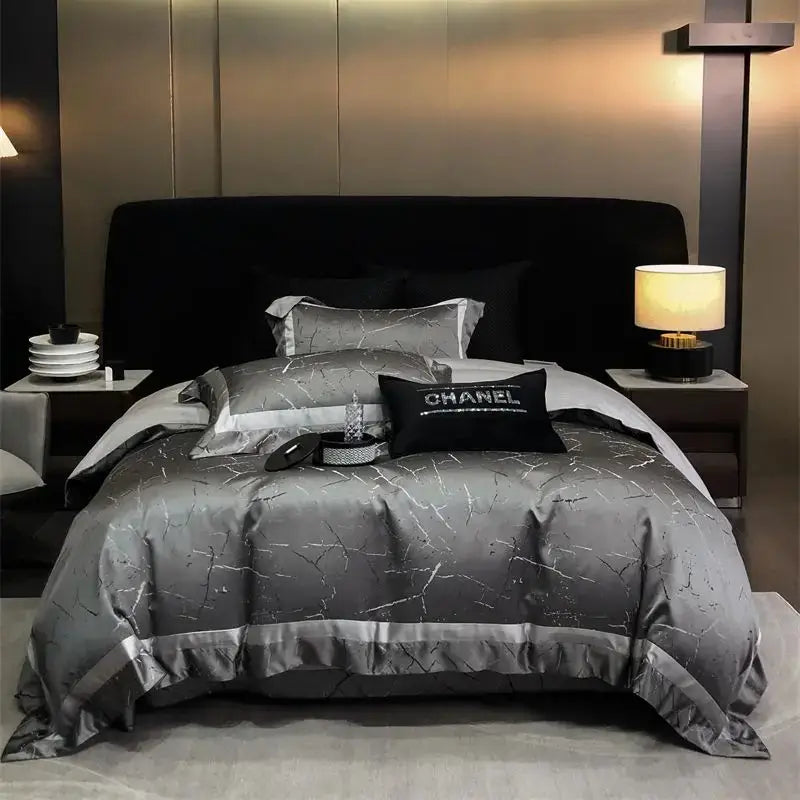 Luxury gold and silver brocade satin jacquard bedding set featuring a silver-gray satin duvet cover with crackled pattern and chanel logo pillows