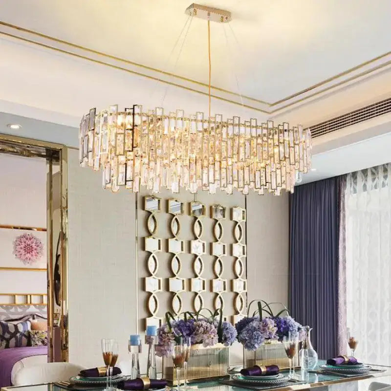 Modern rectangular luxury gold steel crystal pendant chandelier with cascading clear prisms for dining room decorbites gold steel