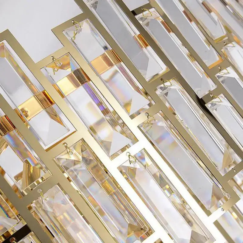 Luxury gold steel crystal pendant chandelier with gold-toned geometric frame and faceted crystal prisms for dining room decorbites gold steel
