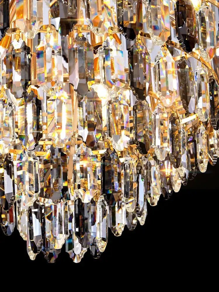 Luxury gold tiered crystal pendant chandelier with faceted prisms and metal accents perfect for dining room decorbites crystal pendant