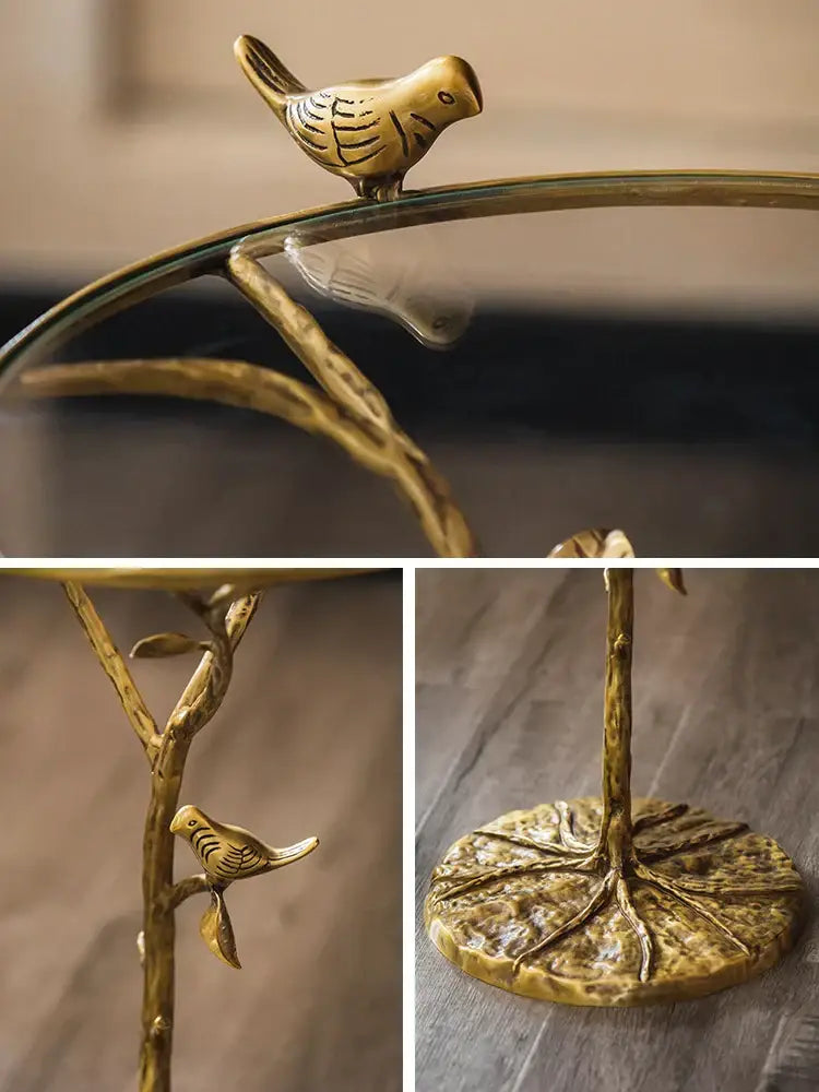 Luxury golden brass bird tree side table with decorbites brass bird figurine on glass top and leaf patterned base