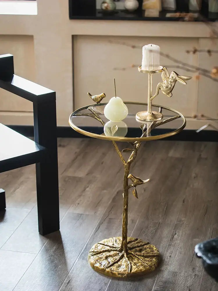 Luxury golden brass bird tree side table with glass top and intricate branch design by decorbites brass bird decor