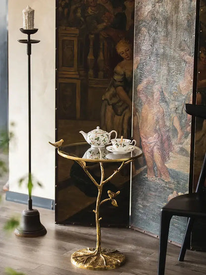 Luxury golden brass bird tree side table with glass top and decorative birds for living room decorbites brass bird design